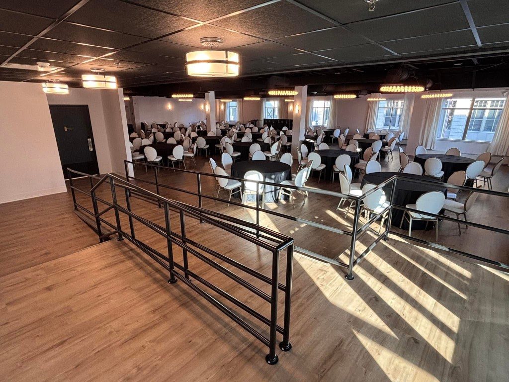 Wood look plank flooring in a banquet hall, installed by Barefoot Flooring