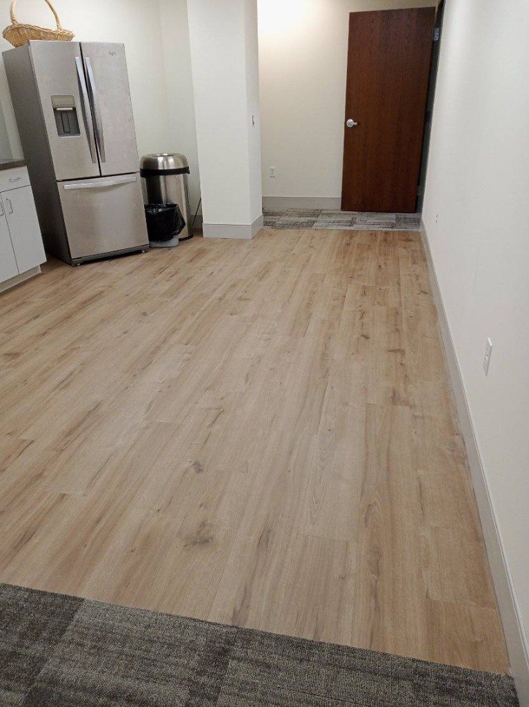 Wood look plank flooring in a commercial breakroom