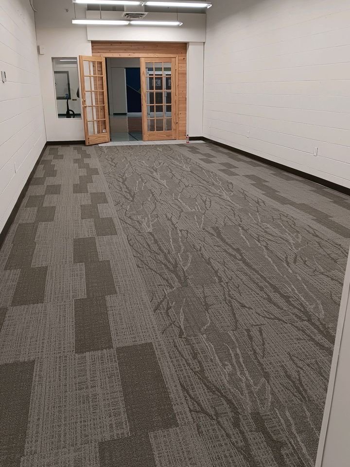 Patterned commercial carpet tile in a large room